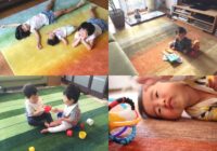 ハグみじゅうたんの上で子供が寝ている写真